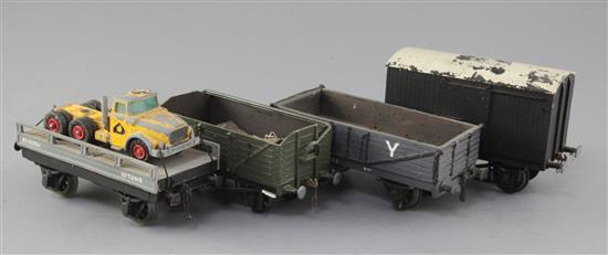 A set of four: 6 plank open wagon with cover, Flat wagon with lorry load No 101261, L1 6 plank open wagon No 663 and a Box van